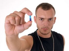 men hold pills to increase potency